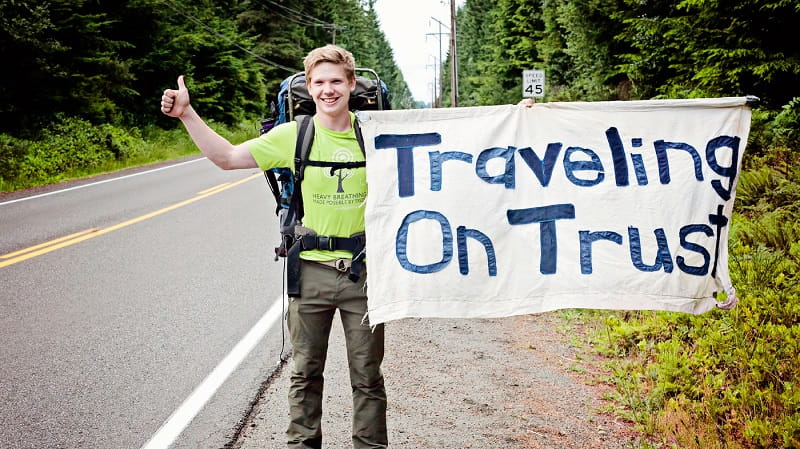 Josh deLacy poses with his sign