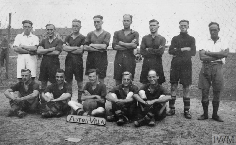 Group photograph of the "Aston Villa" football team, made of British POWs, at the Stalag XXID, Poznań (Posen). The name of the team would imply those soldiers came from the Birmingham area.