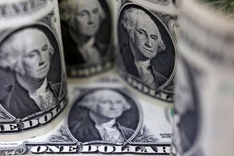 Dollar hits 4-week peak, sterling lower after BOE hike