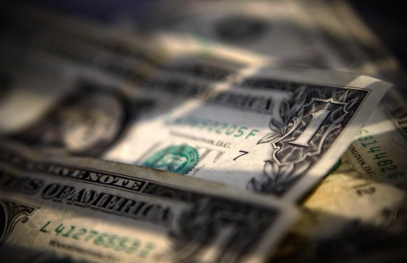 Dollar slips lower ahead of inflation release; euro gains