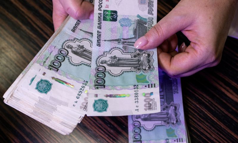 Russian rouble dives back towards over 18-month low vs dollar