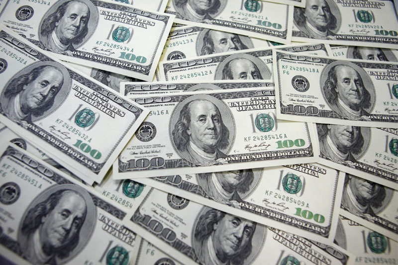 Dollar slips lower, continuing last week's selloff